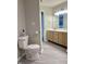 Full bathroom view showing a toilet, vanity, and lighting at 7532 Perilla Ct, Indianapolis, IN 46237