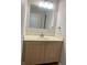 Bathroom vanity with mirror and wood-look cabinets at 7532 Perilla Ct, Indianapolis, IN 46237