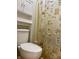 Toilet and shower with decorative shower curtain at 7532 Perilla Ct, Indianapolis, IN 46237