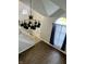 An overhead view of the foyer featuring high ceilings, a decorative light fixture, and a large window at 7532 Perilla Ct, Indianapolis, IN 46237