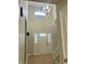 Front entrance hall boasts neutral walls, white trim and front door with sidelights for natural light at 7532 Perilla Ct, Indianapolis, IN 46237