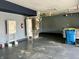 Spacious garage with concrete flooring, shelving, water heater and space for storage at 7532 Perilla Ct, Indianapolis, IN 46237