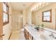 Bright bathroom featuring double sink vanity and glass shower at 7583 Rogers Dr, Indianapolis, IN 46214