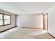 An empty bedroom with large window providing natural light at 7583 Rogers Dr, Indianapolis, IN 46214