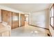 Bedroom featuring a vintage vanity, natural lighting, and a closet at 7583 Rogers Dr, Indianapolis, IN 46214