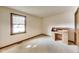 Empty bedroom featuring a vintage desk and a large window at 7583 Rogers Dr, Indianapolis, IN 46214