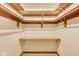 Walk-in closet featuring built-in shelving for storage at 7583 Rogers Dr, Indianapolis, IN 46214