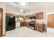 Traditional kitchen featuring wood cabinets, stainless steel oven, and white appliances at 7583 Rogers Dr, Indianapolis, IN 46214