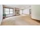 Spacious living room with a brick fireplace and natural light from large window at 7583 Rogers Dr, Indianapolis, IN 46214