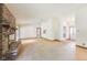 Large living room featuring a brick fireplace and multiple entrances to other areas at 7583 Rogers Dr, Indianapolis, IN 46214