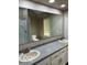 Bathroom featuring double sinks and a large mirror at 7707 River Rd # 10, Indianapolis, IN 46240