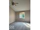 Spacious bedroom with carpet and a large window for natural light at 7707 River Rd # 10, Indianapolis, IN 46240