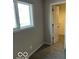 Bedroom with soft neutral colors and an adjacent walk-in closet at 7707 River Rd # 10, Indianapolis, IN 46240