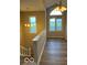 Bright living room featuring hardwood flooring, a large window and pendant lights at 7707 River Rd # 10, Indianapolis, IN 46240