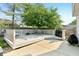 Back patio features a concrete pad and a gray deck with a white lattice railing at 7766 Jamestown S S Dr, Fishers, IN 46038