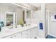 Bright bathroom with double sinks, shower and generous natural light coming from an open doorway at 7766 Jamestown S S Dr, Fishers, IN 46038