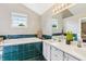 Bathroom boasts double sinks, a soaking tub, and stylish green tiling at 7766 Jamestown S S Dr, Fishers, IN 46038