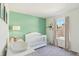 Bright bedroom featuring modern crib, changing table, and neutral gray carpeting at 7766 Jamestown S S Dr, Fishers, IN 46038