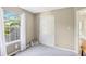 Neutral bedroom features plush carpeting, a window, and an open closet at 7766 Jamestown S S Dr, Fishers, IN 46038