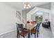 Bright dining area with chandelier and views of the living room and staircase at 7766 Jamestown S S Dr, Fishers, IN 46038