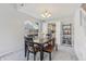 Cozy dining room with natural light and view of the kitchen through doorway at 7766 Jamestown S S Dr, Fishers, IN 46038