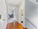 Hallway with hardwood floors leading to a bedroom and bathroom at 7766 Jamestown S S Dr, Fishers, IN 46038