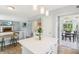 View of the kitchen island and dining room with tile flooring at 7766 Jamestown S S Dr, Fishers, IN 46038