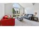 Bright living room with vaulted ceiling and large window at 7766 Jamestown S S Dr, Fishers, IN 46038