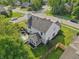 Aerial view of the home's back exterior showing a nice lawn and a screened-in back porch for relaxation at 7766 Jamestown S S Dr, Fishers, IN 46038