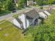 Aerial view of home's rear featuring a well-maintained lawn and an enclosed patio area for outdoor enjoyment at 7766 Jamestown S S Dr, Fishers, IN 46038