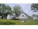 Back exterior view of the house including a wooden deck at 7879 Main St, Coatesville, IN 46121