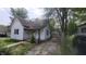 Charming front exterior view of a two-story home with a well-maintained yard and driveway at 7879 Main St, Coatesville, IN 46121