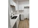 Contemporary kitchen with white cabinets and bright countertop at 802 N Oakland Ave, Indianapolis, IN 46201