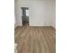 Open-concept living area with light wood flooring and white trim at 802 N Oakland Ave, Indianapolis, IN 46201