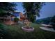 Picturesque backyard with a fire pit, deck, and dock on the tranquil lake at 8426 N Chickadee Dr, Morgantown, IN 46160
