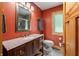 Well-lit bathroom featuring a granite vanity, and wood trimmed window at 8426 N Chickadee Dr, Morgantown, IN 46160