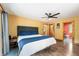 Spacious bedroom featuring wood floors, ample natural light, and a connected bathroom at 8426 N Chickadee Dr, Morgantown, IN 46160