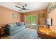 Bright bedroom with a modern ceiling fan, access to deck, and contemporary furniture at 8426 N Chickadee Dr, Morgantown, IN 46160