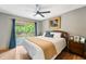 Comfortable bedroom with deck access, neutral walls, and natural light at 8426 N Chickadee Dr, Morgantown, IN 46160