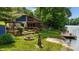 Waterfront home with multiple decks, lake access, and a charming fire pit area at 8426 N Chickadee Dr, Morgantown, IN 46160