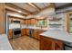 This kitchen offers stainless steel appliances, wood cabinets, and bright countertops at 8426 N Chickadee Dr, Morgantown, IN 46160