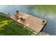 Lake view featuring a dock with chairs and decorative planters at 8426 N Chickadee Dr, Morgantown, IN 46160