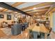 Spacious living area with wood floors, dining table, and comfortable seating at 8426 N Chickadee Dr, Morgantown, IN 46160