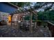 Outdoor patio and string lights create a warm ambiance overlooking the serene lake at 8426 N Chickadee Dr, Morgantown, IN 46160
