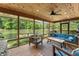 Inviting screened porch with comfortable seating and scenic lake views at 8426 N Chickadee Dr, Morgantown, IN 46160