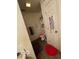 Bathroom features a toilet with flower decoration, storage cabinet and wall decor at 8457 Kousa Dr, Indianapolis, IN 46234