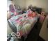 Bedroom featuring a bed, desk, mirror, and window, creating a cozy and functional living space at 8457 Kousa Dr, Indianapolis, IN 46234