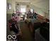Bright bonus room with a window providing natural light, a cozy sofa, and ample storage at 8457 Kousa Dr, Indianapolis, IN 46234
