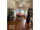 Eat-in kitchen area with oak table and chairs, large window, and vinyl wood flooring at 8457 Kousa Dr, Indianapolis, IN 46234