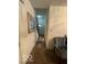 Hallway with a view of the front door, carpet flooring, and wall art at 8457 Kousa Dr, Indianapolis, IN 46234